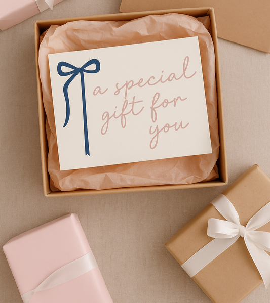 Gift voucher card in a box with 'a special gift for you' text and a bow, surrounded by baby shower gifts.